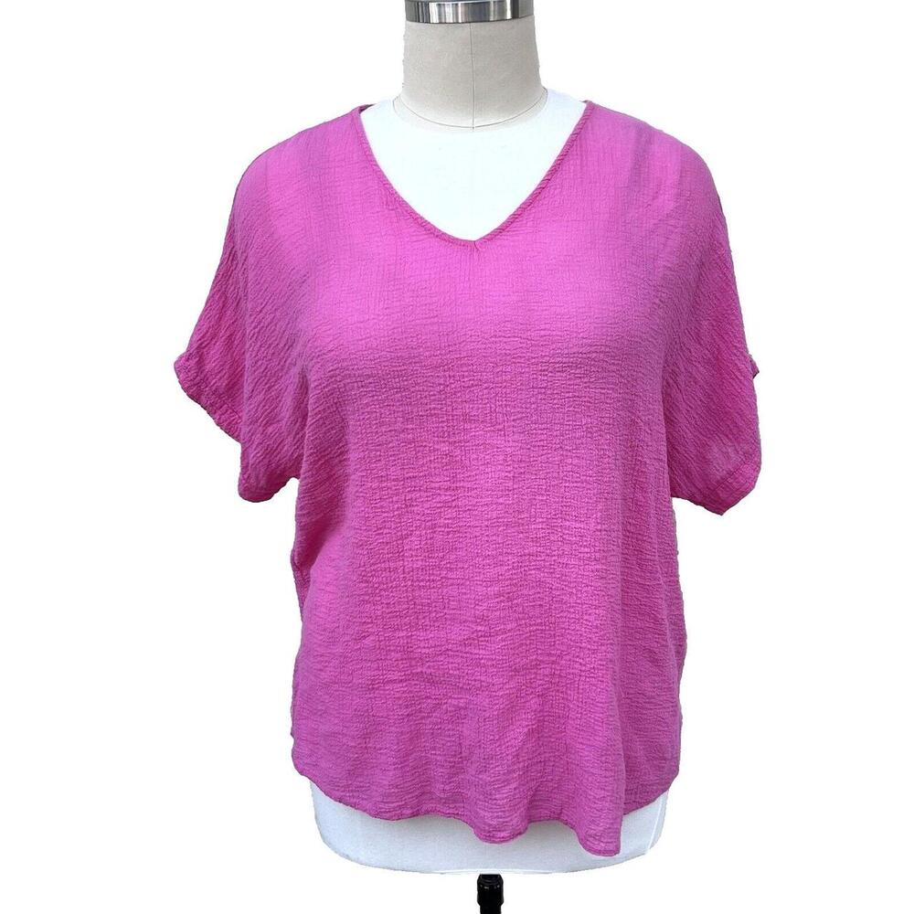Crafted with comfort and style in mind, this Women's Pink V-Neck Dolman Top, mad